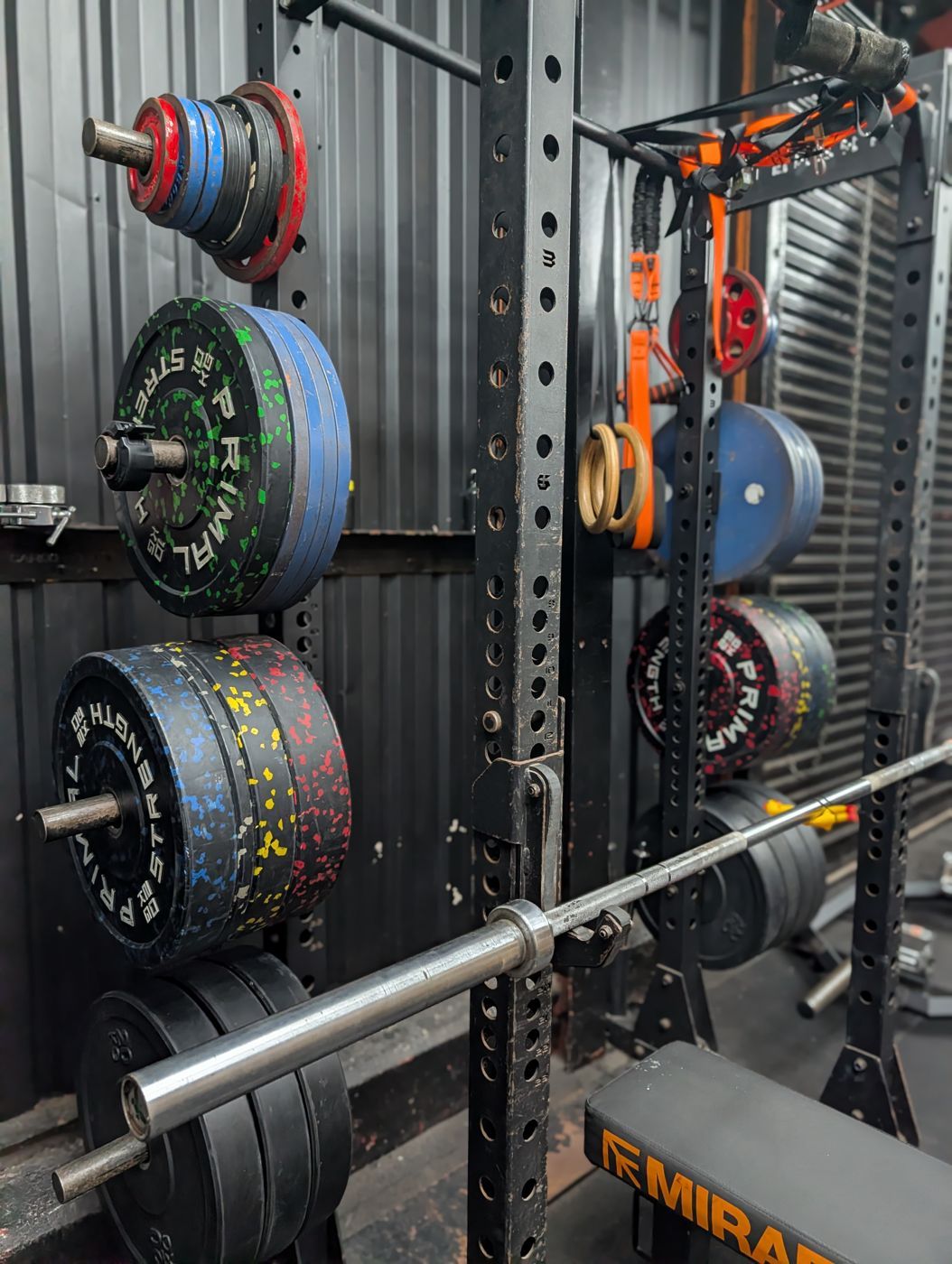 Bumper and calibrated plates stored on the rack