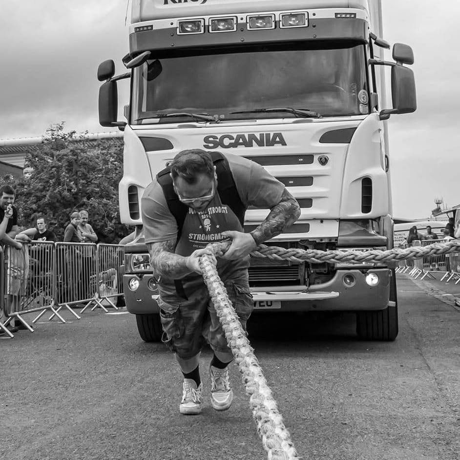 Vinny Jones pulling a Scania truck in competition